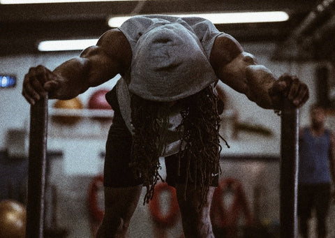 Gym guy pushing weights